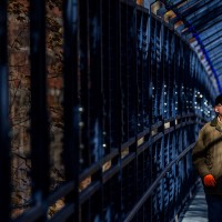 Man walking through the bridge